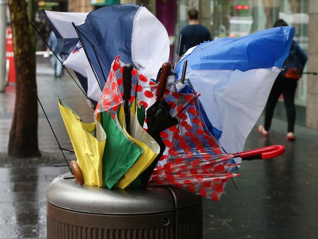 Broken umbrellas fill a bin on Oxford Street due to wild weather that has hit Sydney. Picture Cameron Richardson