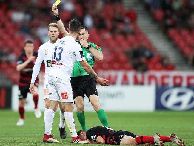 Central Coast’s Aiden O'Neill is shown a yellow card after fouling Jordan ODoherty. Picture: Getty Images