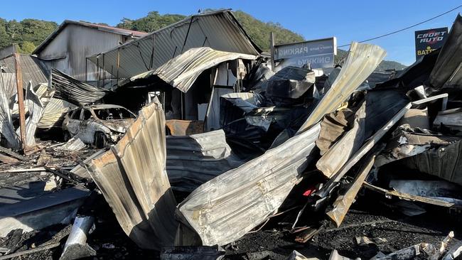 One day after the fire that tore through Croft Auto workshop on Sheridan St, Cairns, the smell of smoke, charred metal and burnt chemicals still filled the air. Picture: Alison Paterson