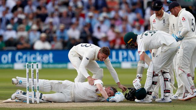 Steve Smith lays on the pitch after being hit in the head by a ball from the bowling of England's Jofra Archer at Lord’s last year Picture: AFP