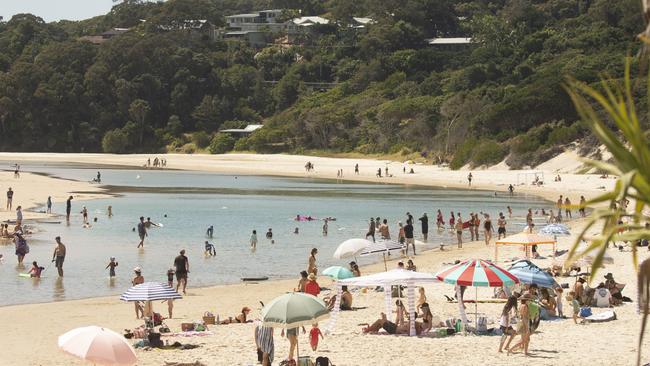 People enjoying the beach in Byron Bay on Sunday. Picture: MEDIA-MODE.COM