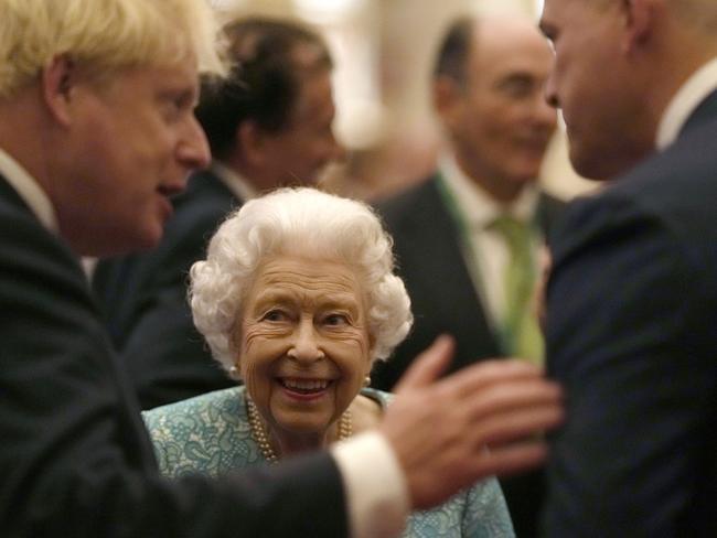 The Queen and Boris Johnson greet guests during a reception for international business and investment leaders at Windsor Castle last October. Picture: Getty Images