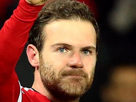 Manchester United's Juan Mata celebrates scoring his side's first goal of the game, during the English Premier League soccer match between Manchester United and Watford, at Old Trafford, in Manchester, England, Wednesday March 2, 2016. (Martin Rickett/PA via AP) UNITED KINGDOM OUT NO SALES NO ARCHIVE