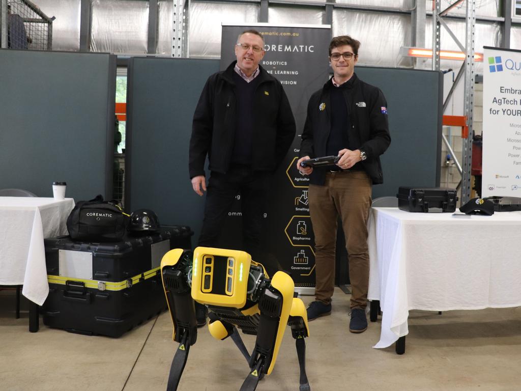 The robotic dog named 'Spot' with Corematic National Project Manager, Cyril Delorm (left).