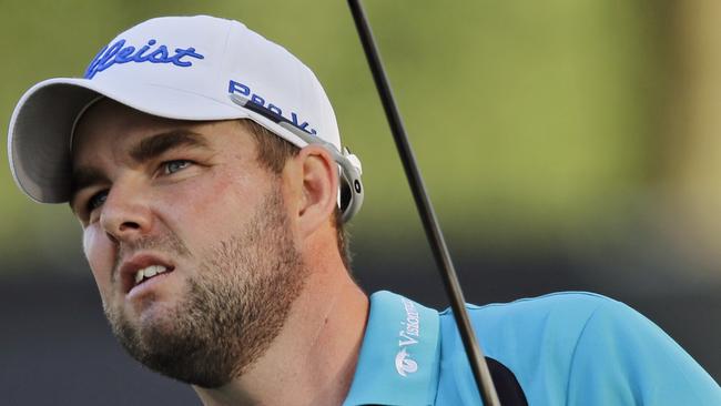 Marc Leishman, from Australia, watches his drive on the 18th hole during the final round of the Bridgestone Invitational golf tournament Sunday, Aug. 3, 2014, at Firestone Country Club in Akron, Ohio. Leishman finished third, three shots behind winner Rory McIlroy. (AP Photo/Mark Duncan)