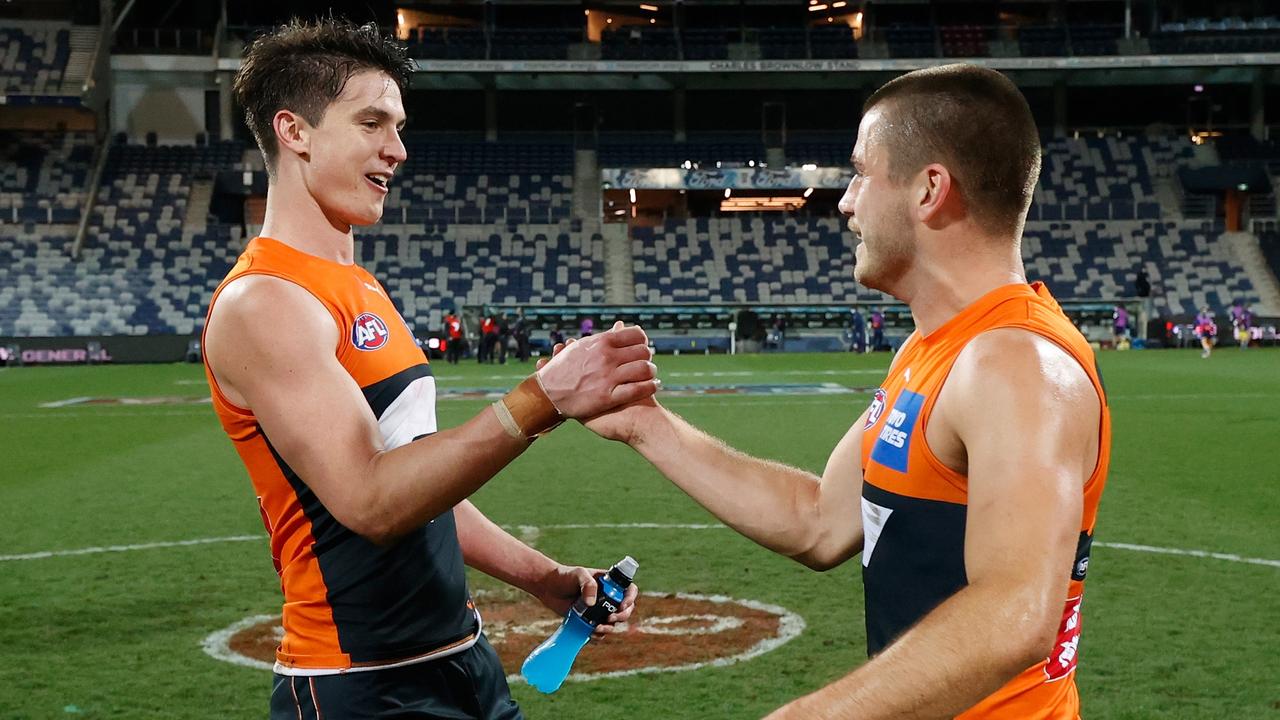 Sam Taylor celebrates with Xavier O'Halloran post-match. Picture: Michael Willson/AFL Photos via Getty Images