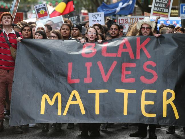 Aboriginal and Torres Strait Islanders communities and allies march during a protest in Melbourne on Wednesday. Picture: David Crosling