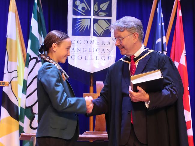 The new principal is greeted by students at the ceremony. Picture: Glenn Hampson.