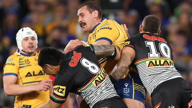 Reagan Campbell-Gillard is belted by Moses Leota and James Fisher-Harris in the grand final. Picture: Mark Kolbe/Getty Images