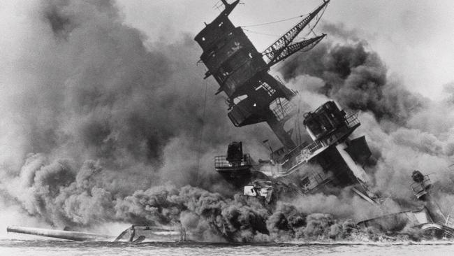 Battleship USS Arizona topples over during the Japanese surprise attack on Pearl Harbor.