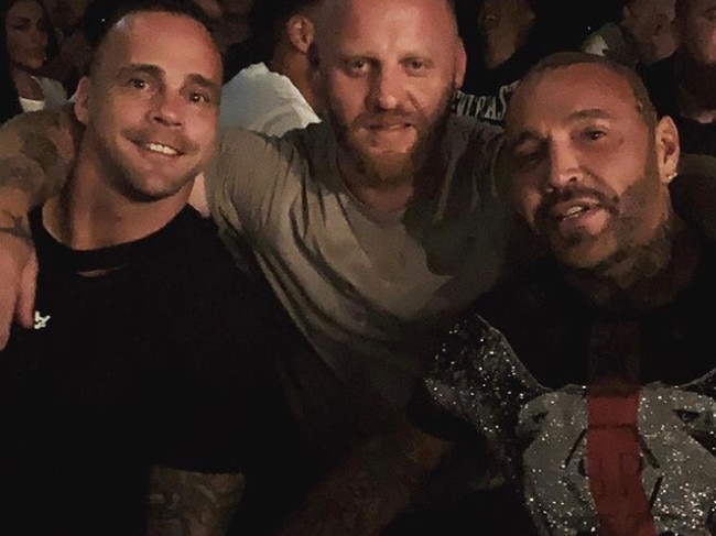 Former bikie enforcer Toby Mitchell with ex-Tigers player Jake King at an MMA match in Melbourne