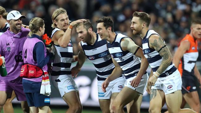 Stewart Crameri is mobbed by teammates after a goal. Picture: AAP