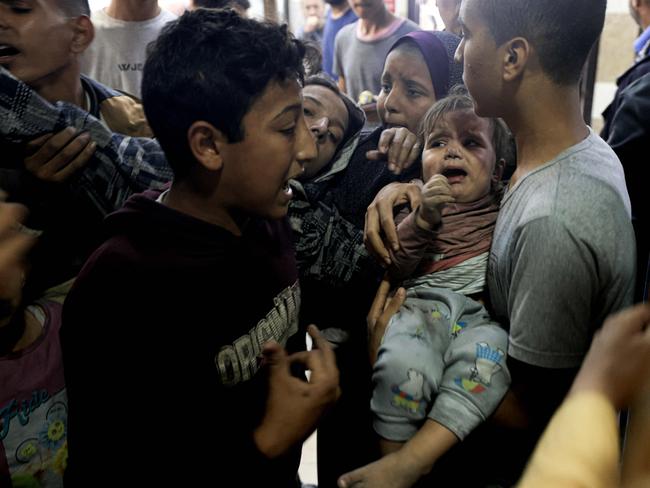 A wounded Palestinian child and other members of the Baraka family arrive at Nasser Hostpial in Khan Yunis. Picture: AFP