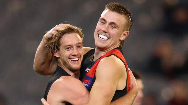 Darcy Parish and Josh Begley celebrate a goal in Essendon’s win over Carlton. Picture: Getty Images