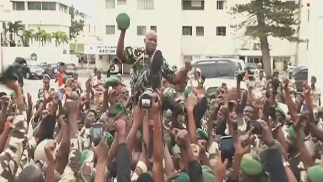 Brice Oligui Nguema is held aloft by his comrades in arms. Picture: AFP