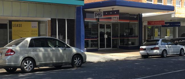 Three ‘For Lease’ signs adorn shops either side of a gym in the business centre of Wynnum where there are a number of vacancies. Pic: Darren Cartwright