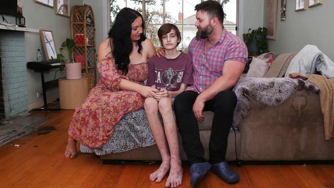 Janelle, Seb and Daniel Bridge at their Lara home. Seb is battling a rare health condition caused by mould in his family home discovered by chance in June. Picture: Alan Barber