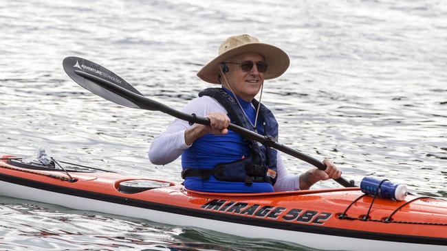 Australian Prime Minister Malcolm Turnbull cruises back to the beach after a kayak on Sydney Harbor on Sunday morning. Picture: Jenny Evans