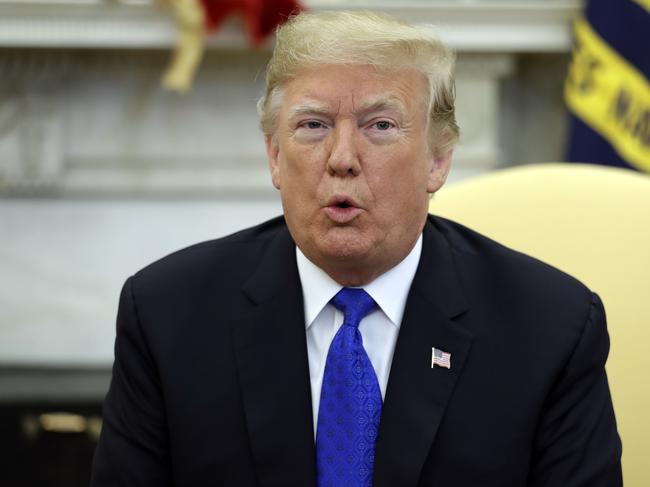 President Donald Trump in the Oval Office. Opinions are divided as to whether he will still be there, a year from now. Picture: AP Photo/Evan Vucci