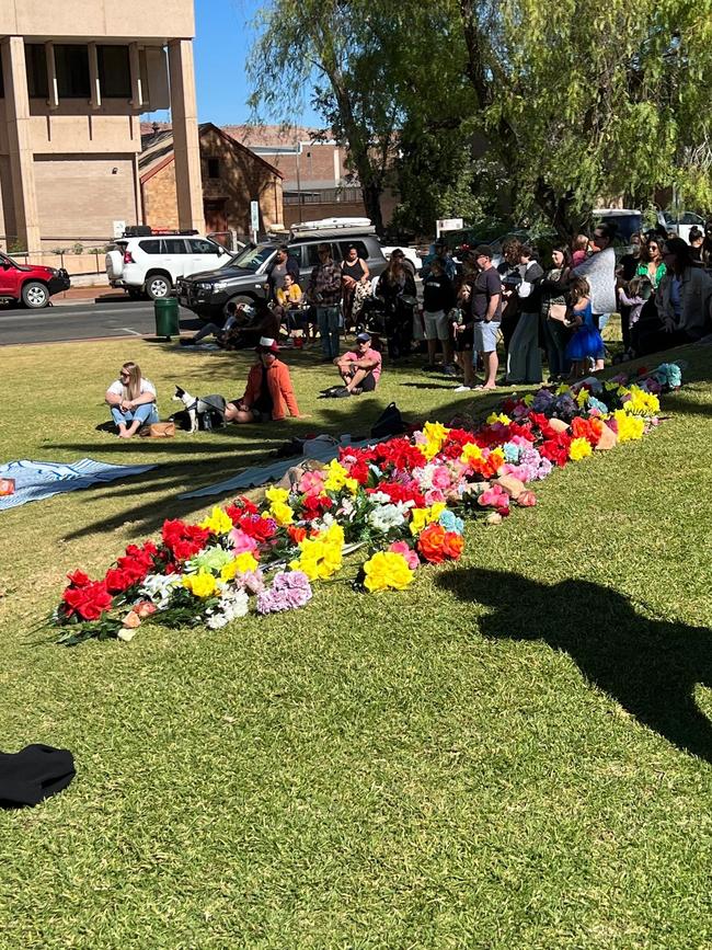 Flowers at the vigil for the mother and baby in Alice Springs. Picture: Tangentyere Women’s Family Safety Group