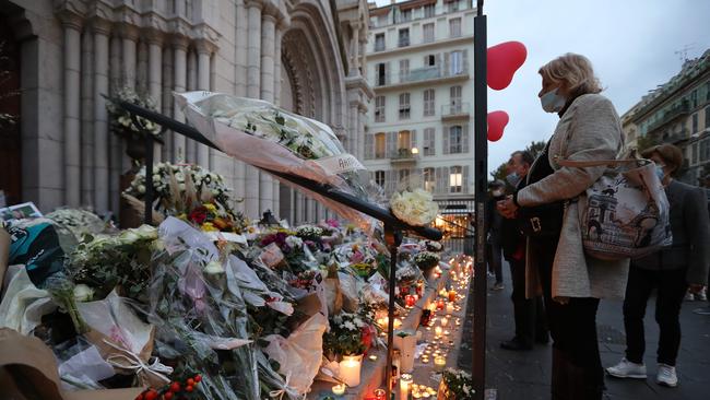 Mourners pay tribute to the victims. Picture: Valery Hache/AFP.