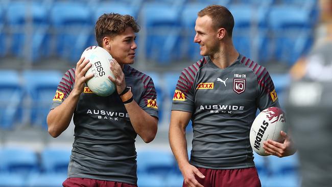 GOLD COAST, AUSTRALIA - JUNE 22: Reece Walsh and Daly Cherry-Evans talk during a Queensland Maroons State of Origin training session at the Cbus Super Stadium on June 22, 2021 in Gold Coast, Australia. (Photo by Chris Hyde/Getty Images)