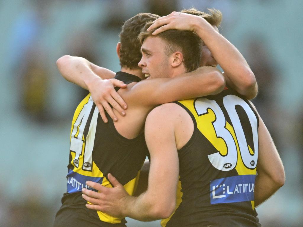 Tom Brown, Sam Banks and Hugo Ralphsmith celebrate Sunday’s win. Picture: Quinn Rooney/Getty Images.