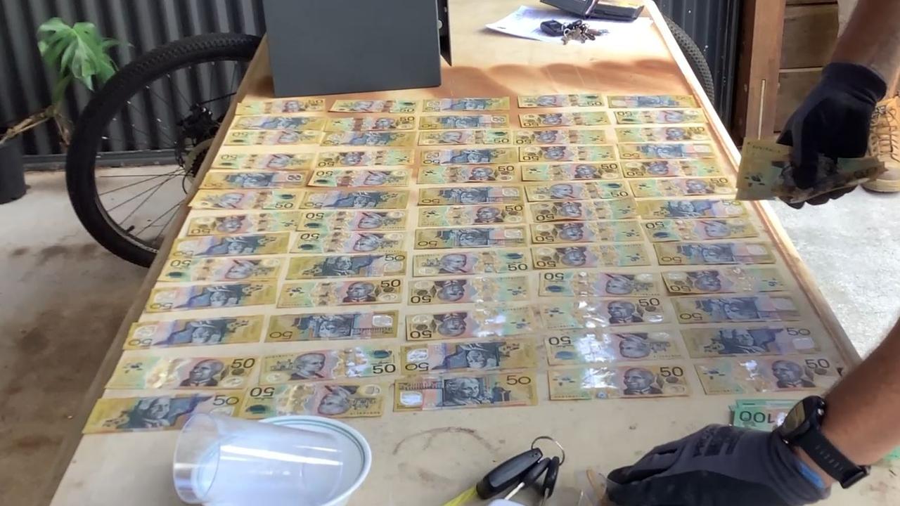 Detectives alleged seized $120,000 during the raid. Picture: QPS