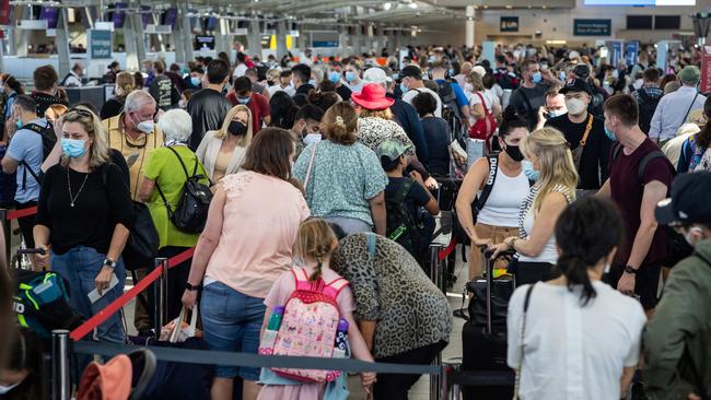 Travellers in queues at the domestic terminal of Sydney Airport. Picture: Julian Andrews.