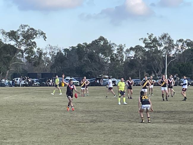 Luke Hodge has a shot for goal.