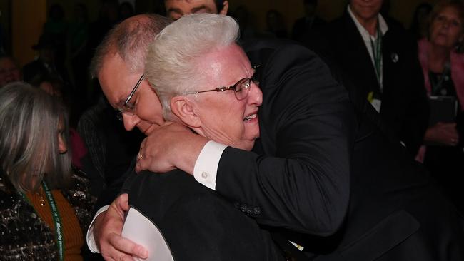 Prime Minister Scott Morrison hugs an abuse survivor after the national apology to victims and survivors of institutional child sexual abuse. Picture: AAP/Lukas Coch