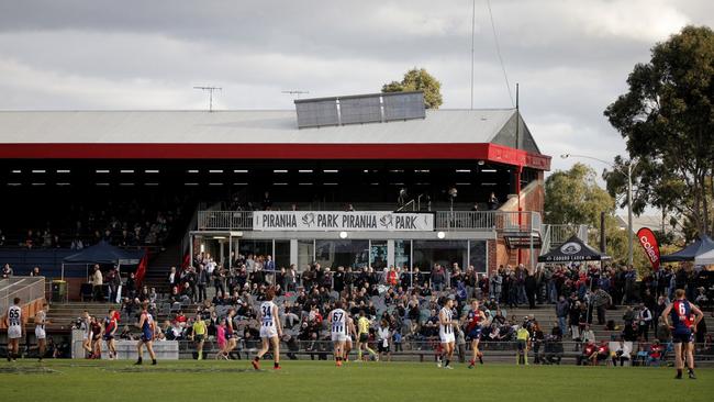 A crowd at Coburg City Oval watches on as Coburg hosts Collingwood in 2018.