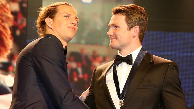 Nat Fyfe congratulates Patrick Dangerfield at the 2016 Brownlow Medal count. Pic: Michael Klein