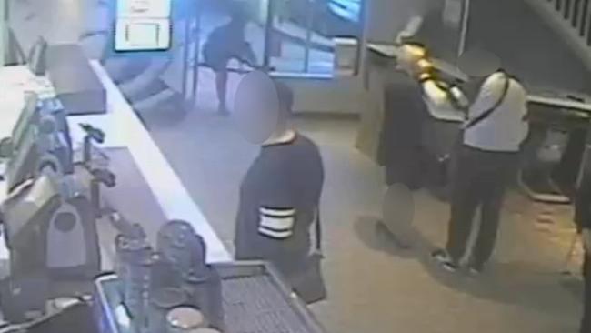 The man puts his hands on the alleged victim’s face while in McDonalds, North Parramatta.