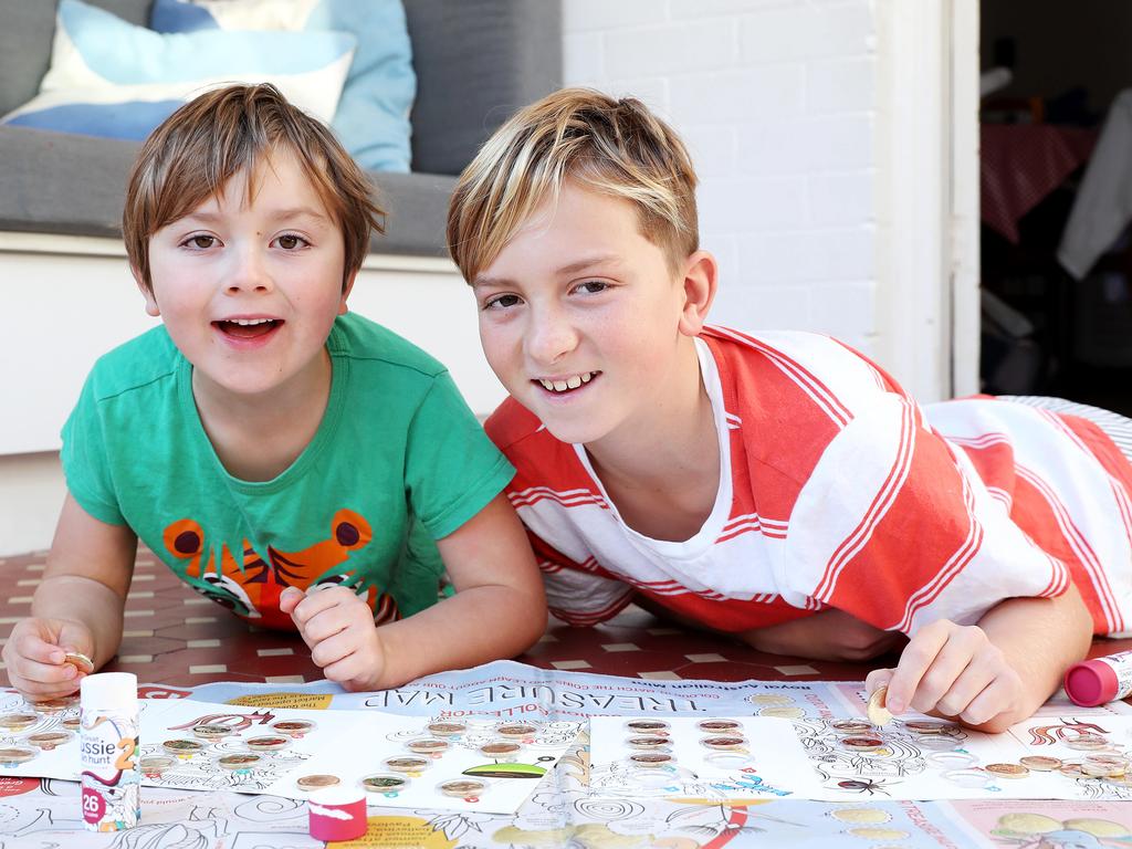 WEEKEND TELEGRAPHS SPECIAL. MUST TALK WITH PIC ED JEFF DARMANIN BEFORE PUBLISHING - Pictured at home in Manly today is Iggy 10 and Atticus Jenkins 6, with Australia Posts Great Aussie Coin Hunt collectables. Picture: Tim Hunter.