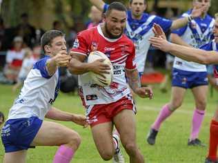 COMING THROUGH: South Grafton Rebels' winger Anthony Skinner spots a gap in between the Ghosts' Mitch Lollback and Riley Law during the Group 2 local derby. Picture: Debrah Novak