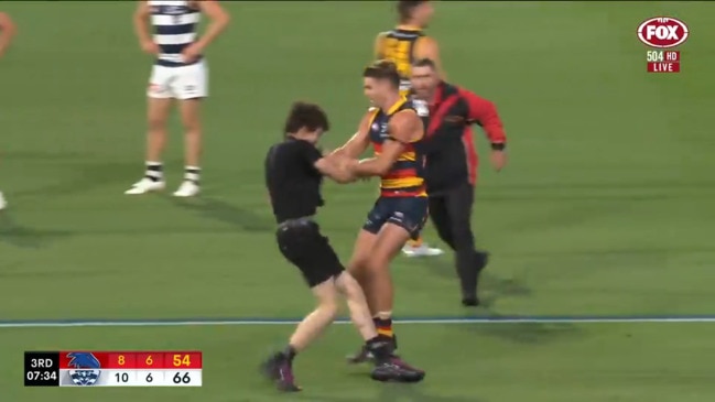 Pitch invader disrupts AFL game