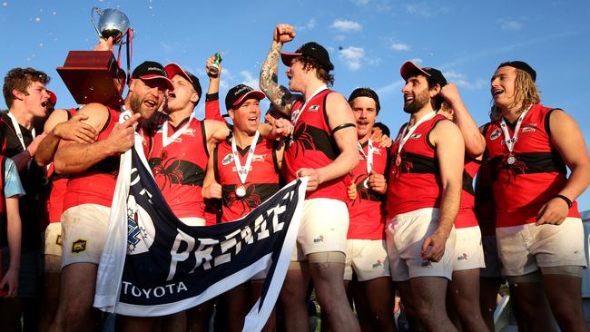 Romsey players celebrate their win in the RDFL grand final on Sunday. Picture: Mark Dadswell