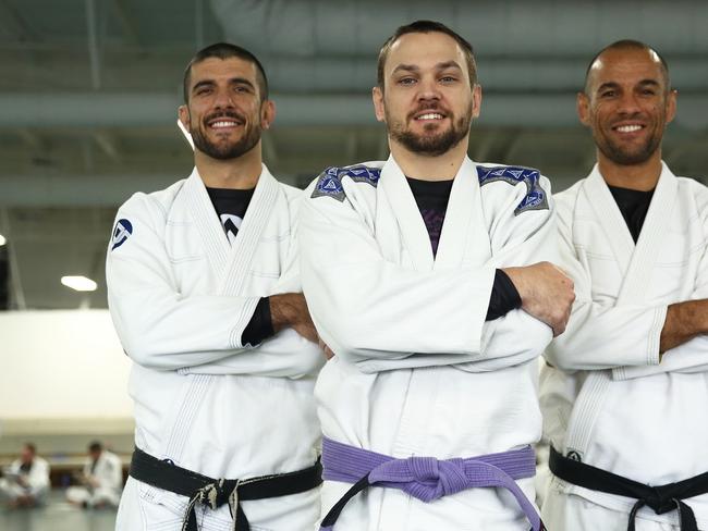 Gracie Jiu-Jitsu Camira owner and head instructor Shaun Harrison with Rener and Ryron Gracie.