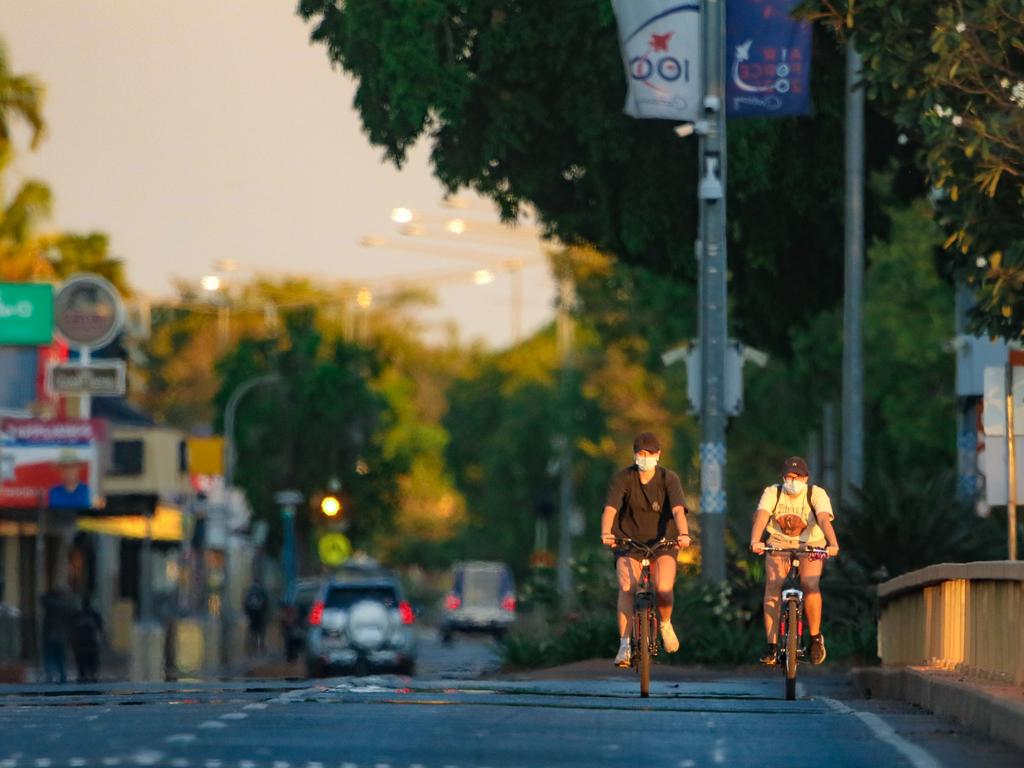 People ride across the Katherine River on Thursday night. Picture: Glenn Campbell