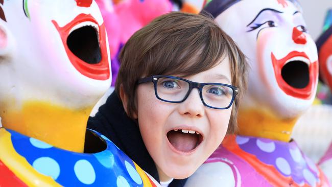 Preston Klohs, 8, from Edmonton, played the laughing clowns game on the second day of the Cairns Show. Picture: Brendan Radke