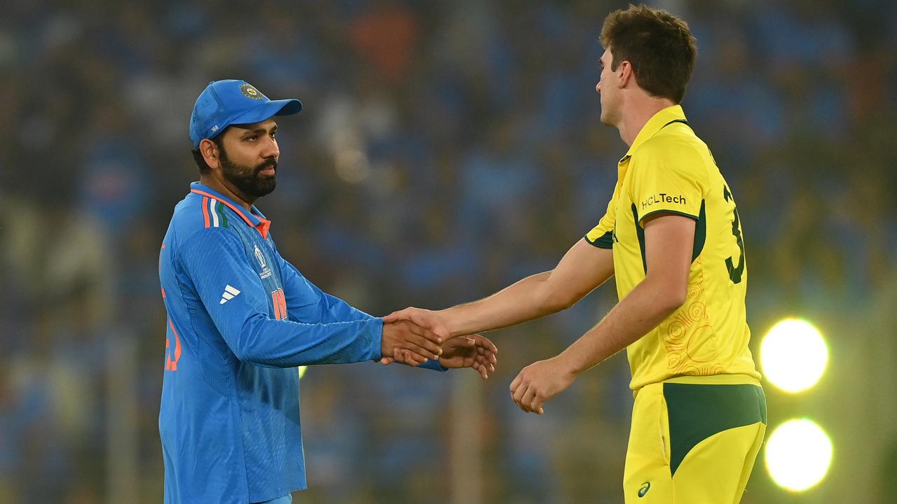 India captain Rohit Sharma shakes hands with Australia captain Pat Cummins after the match. Photo by Gareth Copley/Getty Images.