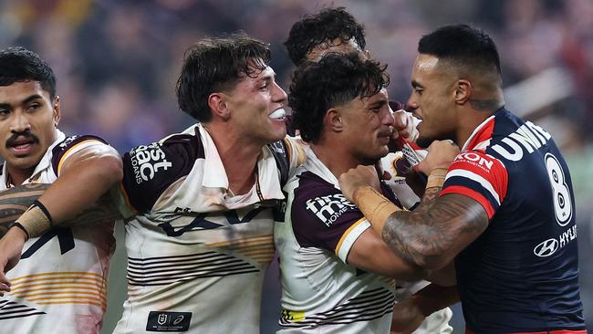 LAS VEGAS, NEVADA - MARCH 02: SpencerÂ Leniu (r) of the Roosters exchanges heated words with KotoniÂ Staggs of the Broncos during the round one NRL match between Sydney Roosters and Brisbane Broncos at Allegiant Stadium, on March 02, 2024, in Las Vegas, Nevada.   Ezra Shaw/Getty Images/AFP (Photo by EZRA SHAW / GETTY IMAGES NORTH AMERICA / Getty Images via AFP)