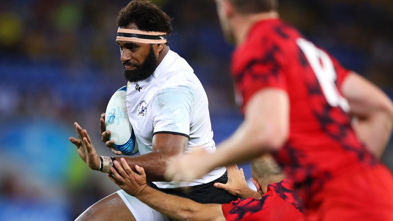 Semi Kunitani of Fiji breaks away to score a try.