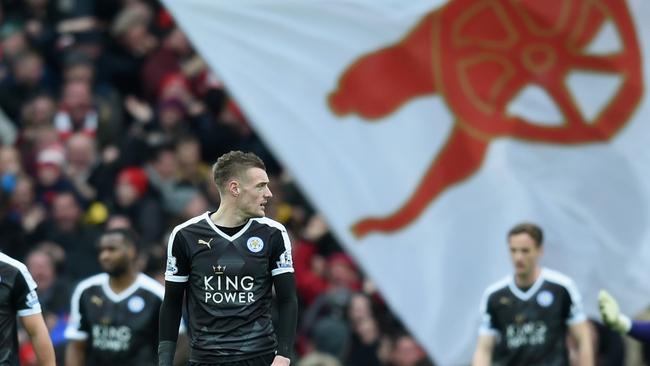 Jamie Vardy of Leicester City, with the Arsenal emblem looming.