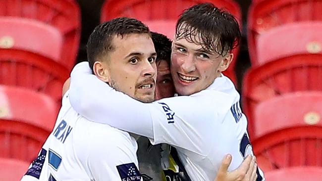 Central Coast Mariners players celebrate with striker Jordan Murray (left) after he scored against the Jets. Picture: Getty Images