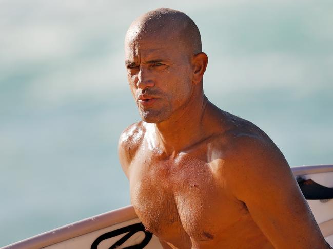 HALEIWA, HAWAII - JANUARY 11: Pro surfer Kelly Slater walks from the ocean at Banzai Pipeline on January 11, 2021 in Haleiwa, Hawaii. (Photo by Cliff Hawkins/Getty Images)