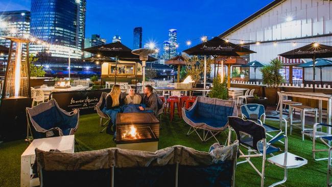 Relaxing around the pop-up Fire Garden at Common Man on South Wharf. Picture: Supplied