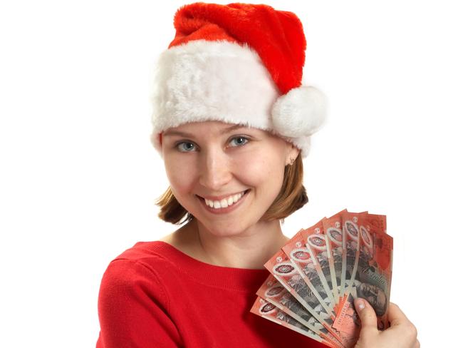 The girl holds banknotes in a hand; Australian money Christmas generic