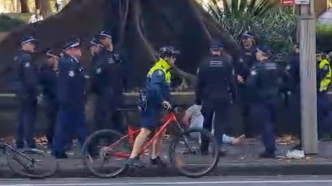 The alleged attacker was surrounded by police before being taken to a hospital. Picture: TNV